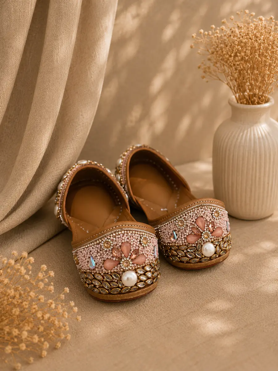 Blush Royal juttis seen from behind, the pink and gold beadwork visible across each toe.