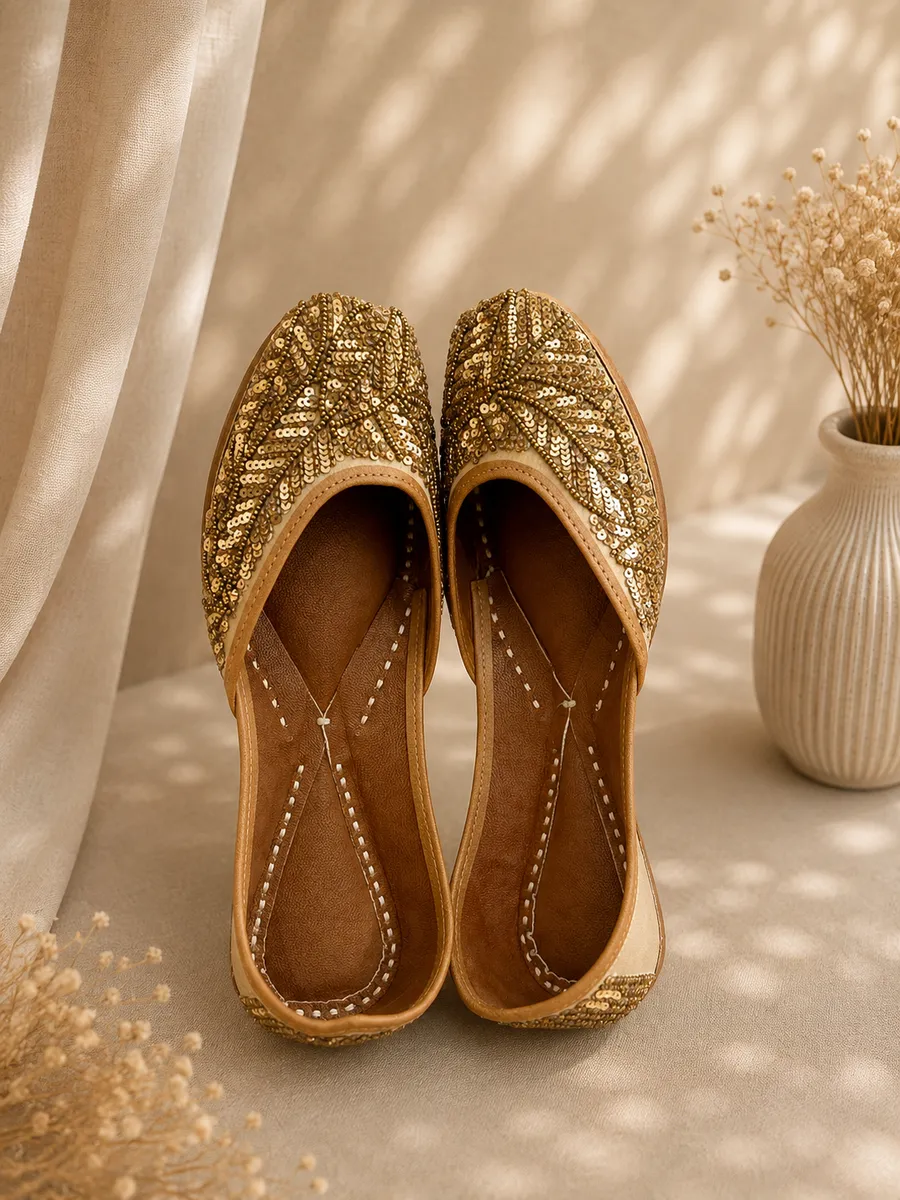 Gold Grace juttis in beige with a dense leaf motif in gold-tone sequin and bead embroidery.