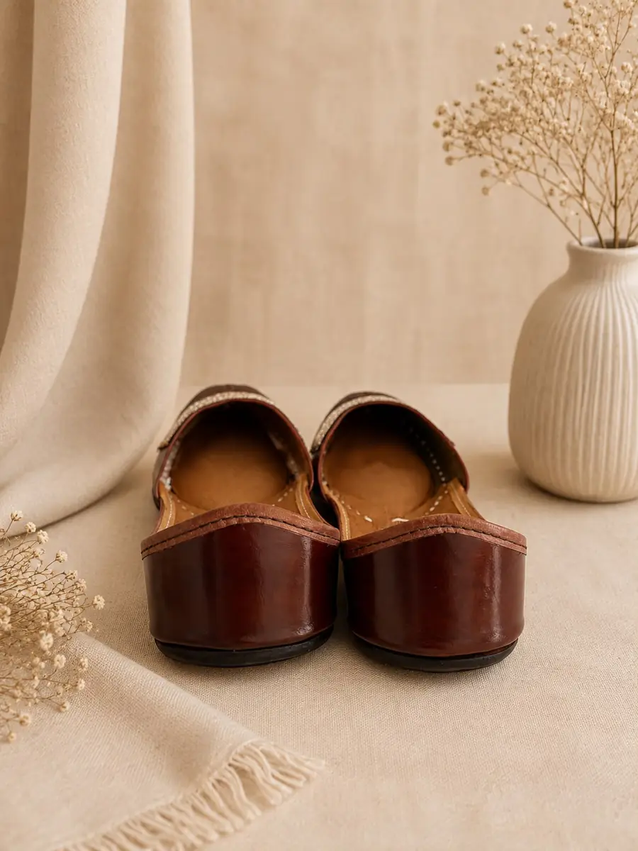 Mocha Grace juttis seen from behind, showing the deep brown leather heel.