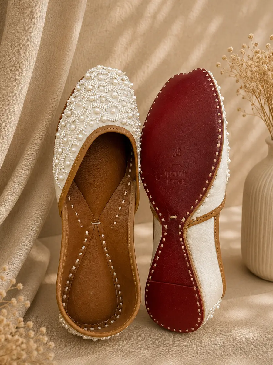 Pearl Grace jutti stood beside its maroon leather sole, stamped with the size and Genuine Leather mark.