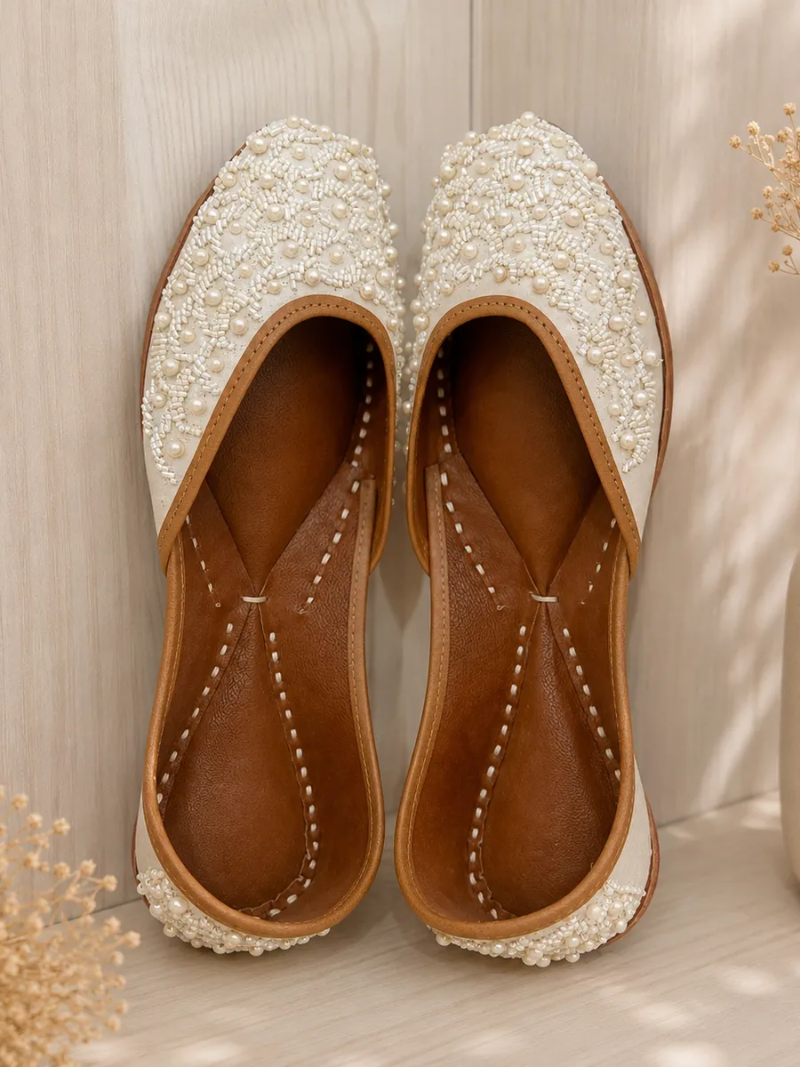 Pearl Grace juttis in ivory with an allover lattice of pearl and bead embroidery.